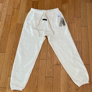 Brand New Essentials Fear of God sweatpants in “Cloud”.